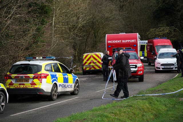 <p>Police at Gravelly Hill in Caterham, Surrey, after a woman was killed  </p>