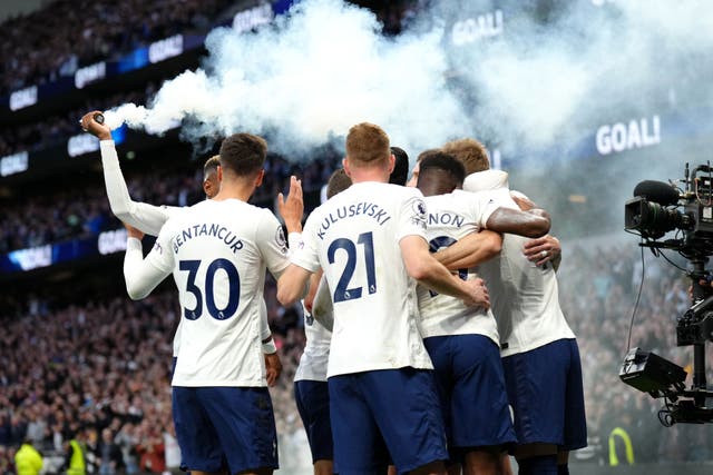 Tottenham players celebrate Harry Kane’s goal against Arsenal last season (John Walton/PA)