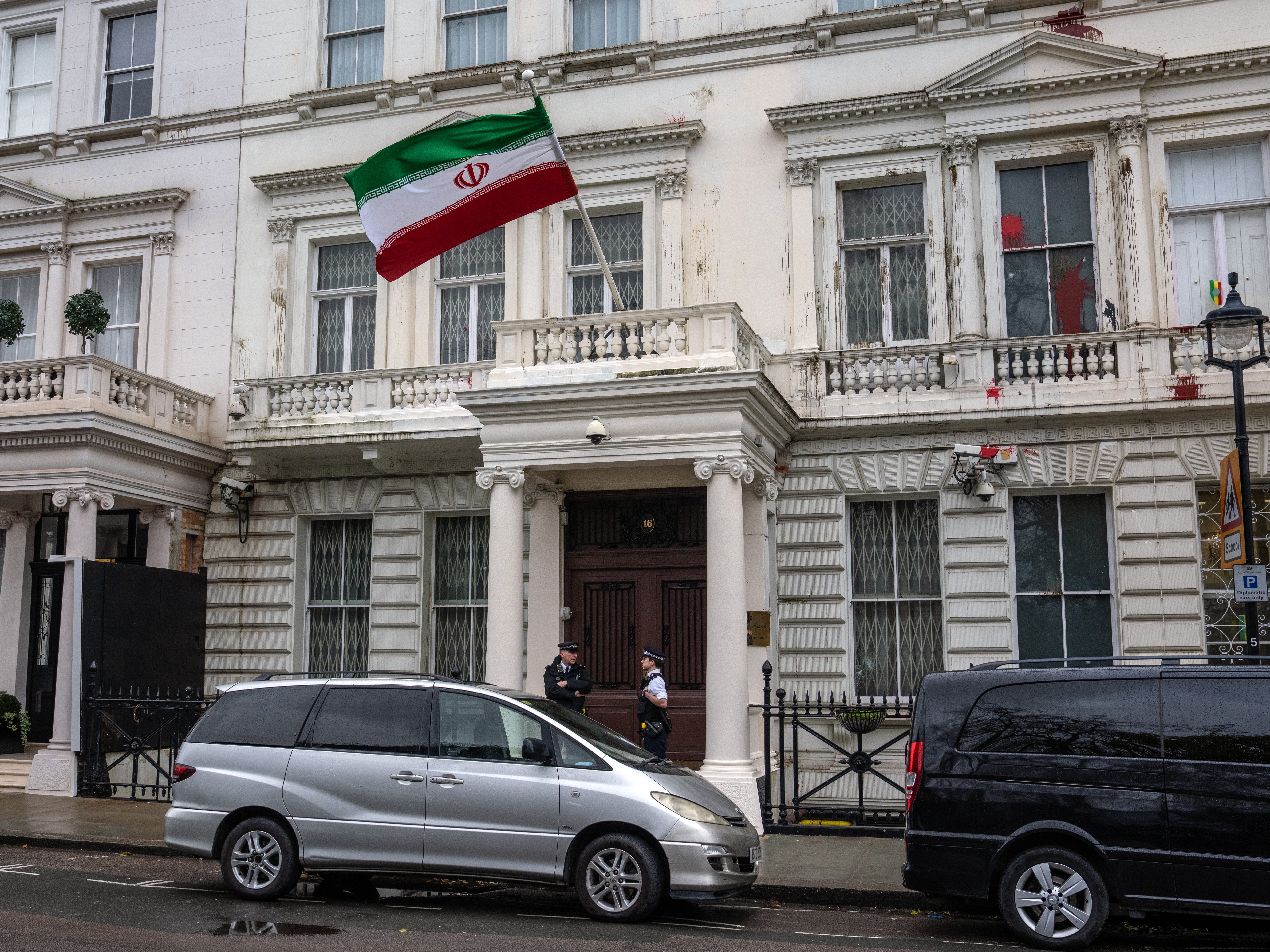 Police on guard outside the Iranian embassy in London