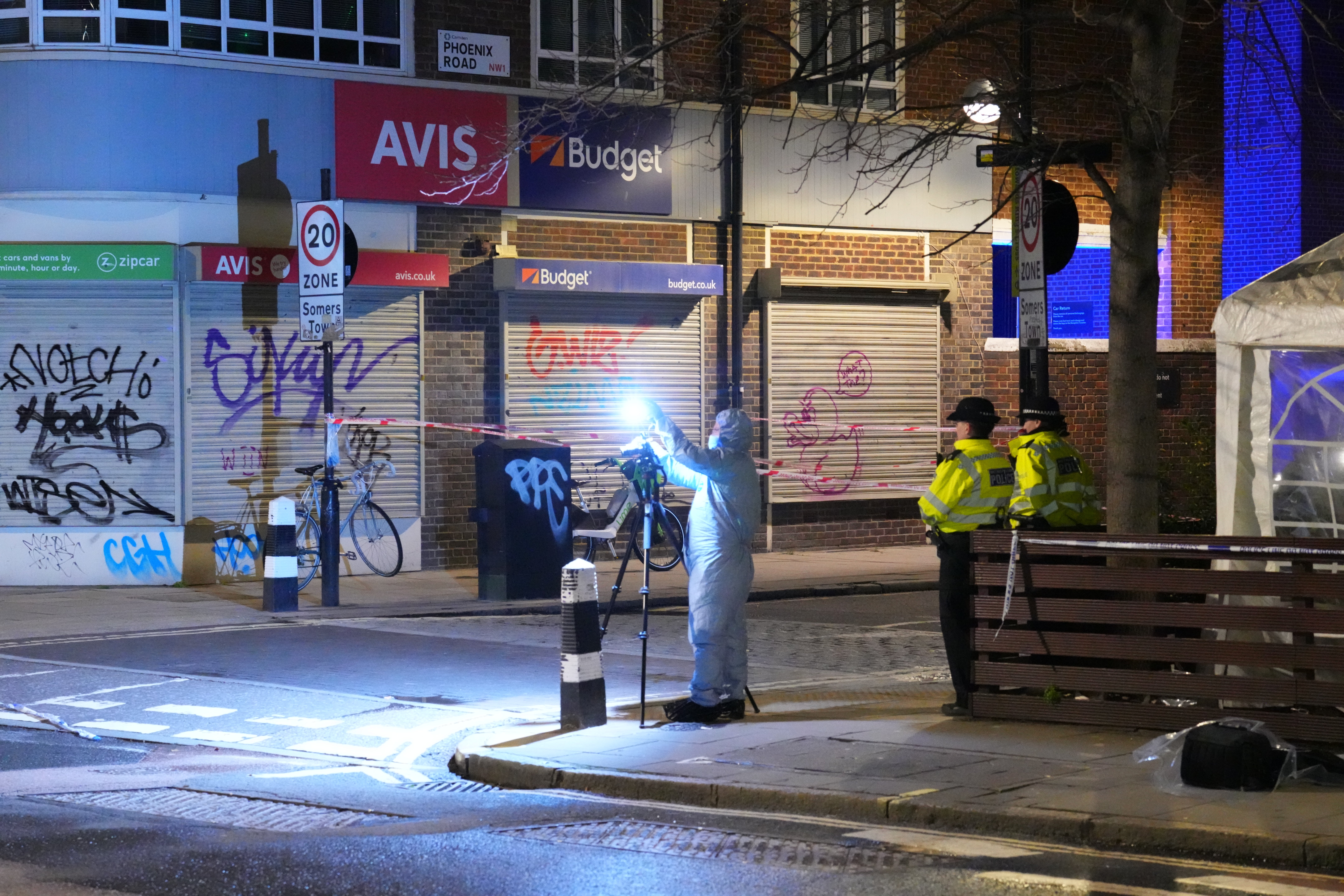 Police forensic officers attend the scene of a shooting near St Aloysius RC Church