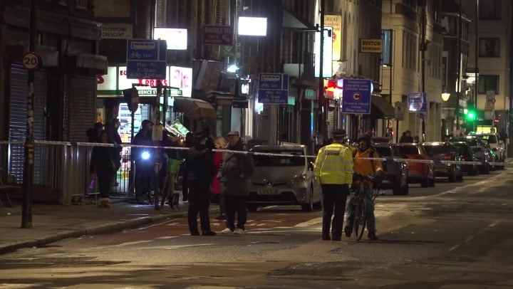 Police cordon drive-by shooting scene in London where girl, 7, and five others were injured