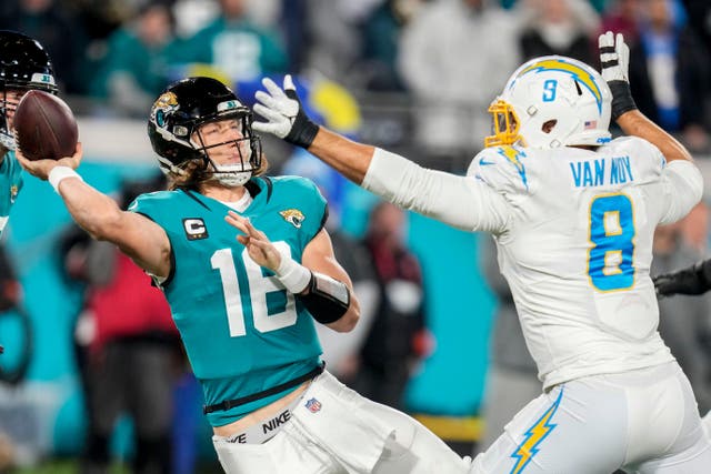 Trevor Lawrence mixed four interceptions with four touchdown passes as he engineered the Jacksonville Jaguars’ comeback victory over the Los Angeles Chargers in the AFC wildcard round (John Raoux/AP)