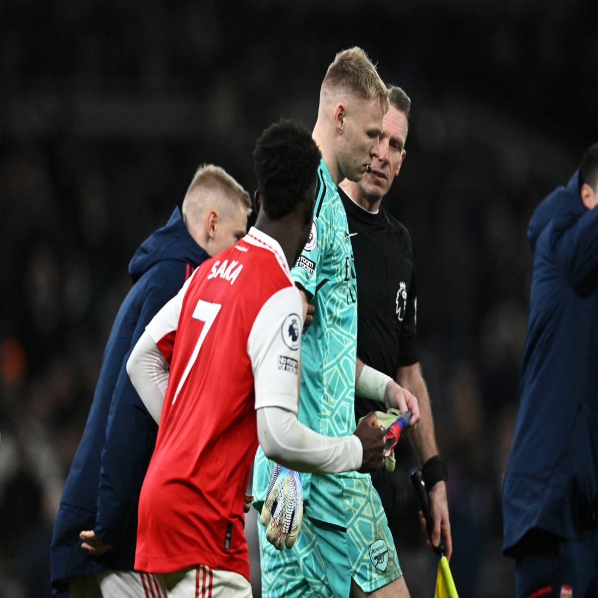 Arsenal goalkeeper Aaron Ramsdale appears to be kicked by