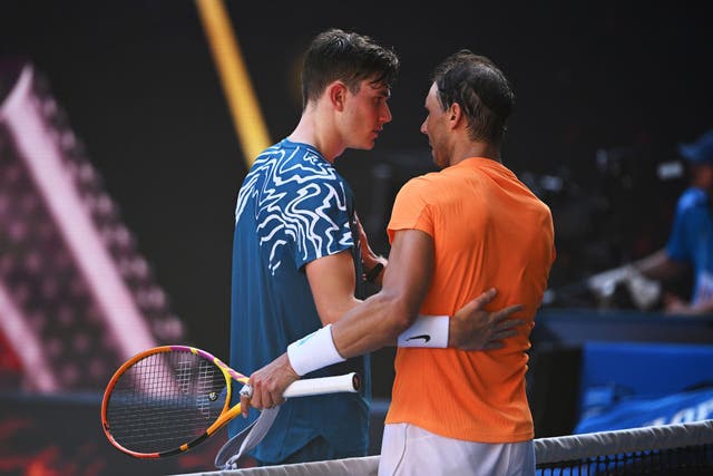 <p>Nadal greets Draper at the net after a battle on Rod Laver Arena  </p>