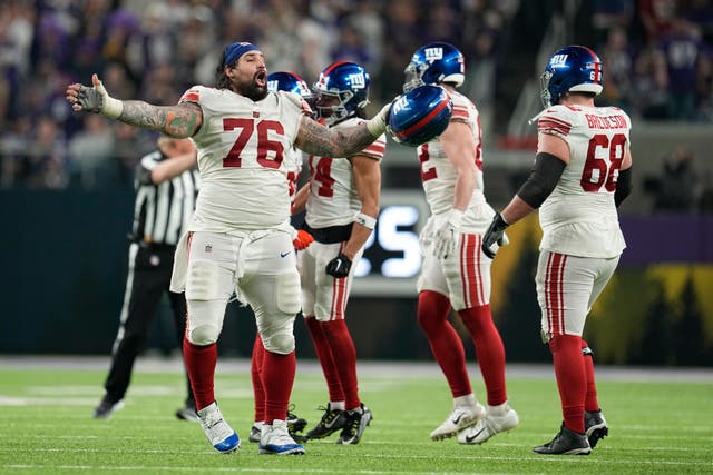 The New York Giants celebrated their first play-off win in 11 years after beating the Minnesota Vikings (Abbie Parr/AP)