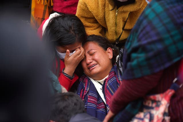 <p>A woman wails as she waits to receive the body of a relative, victim of a plane crash, at a hospital in Pokhara, Nepal</p>