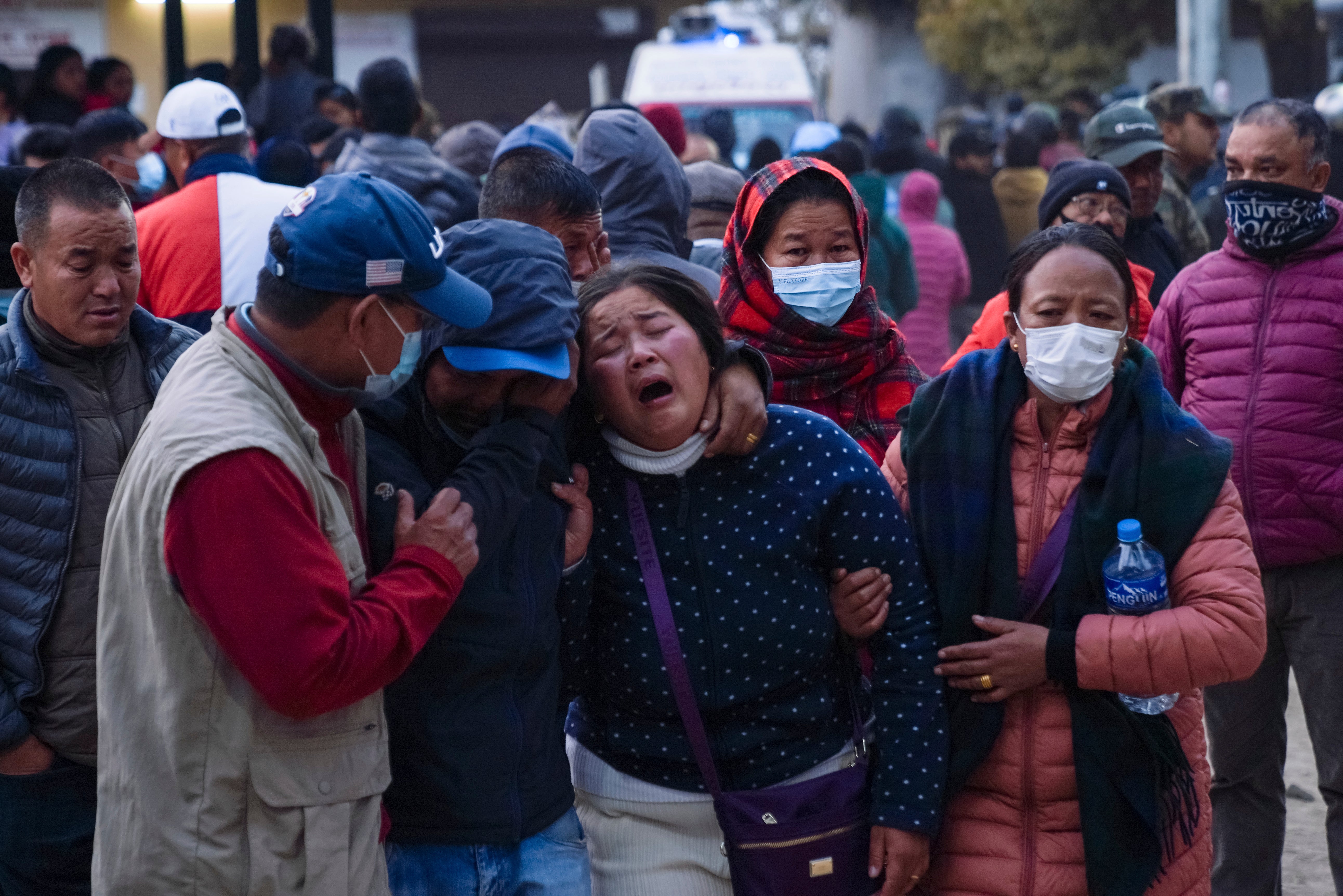 A woman cries as the body of a relative, victim of a plane crash, is brought to a hospital in Pokhara