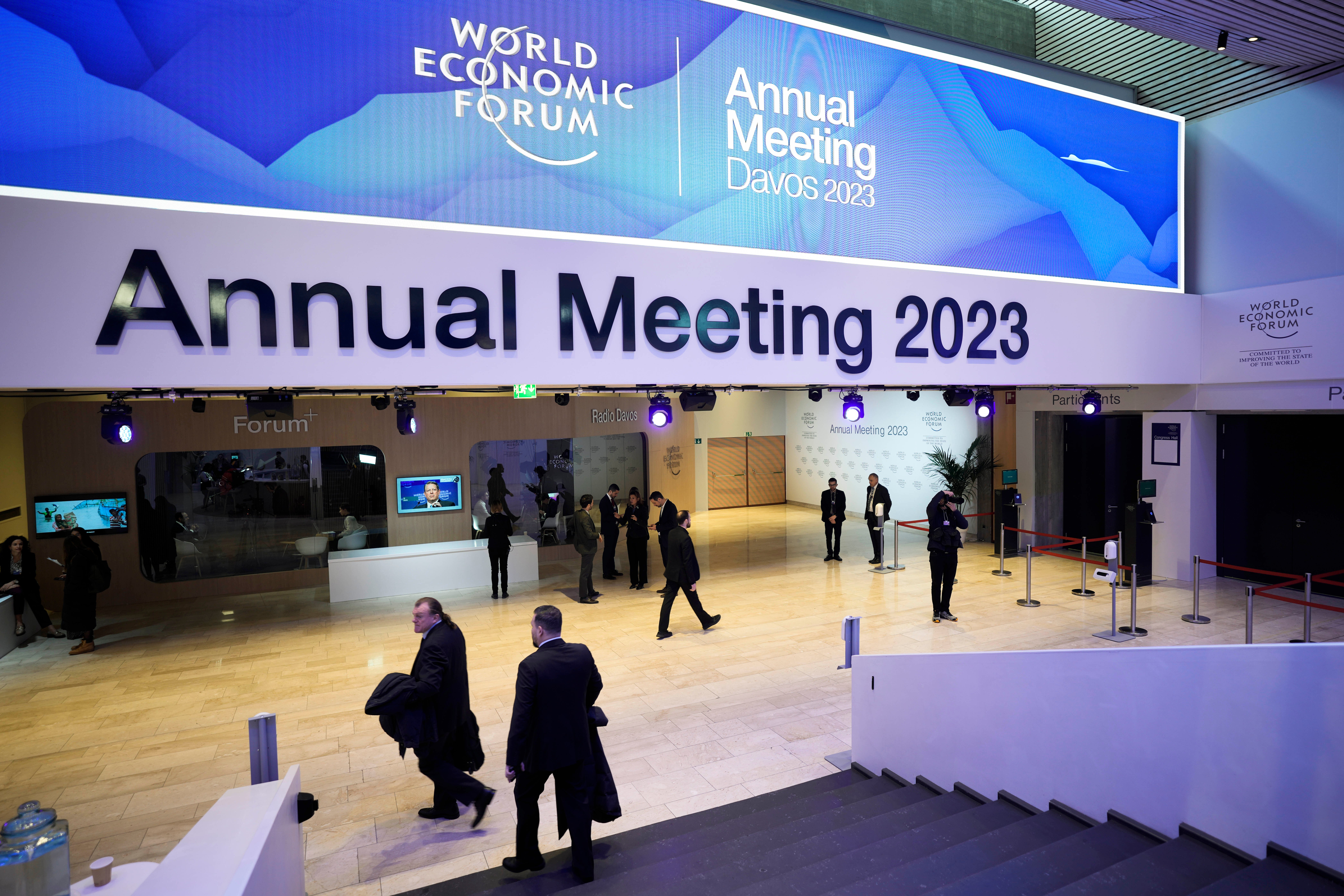 People gather in the Davos Congress Centre prior to the start of the World Economic Forum
