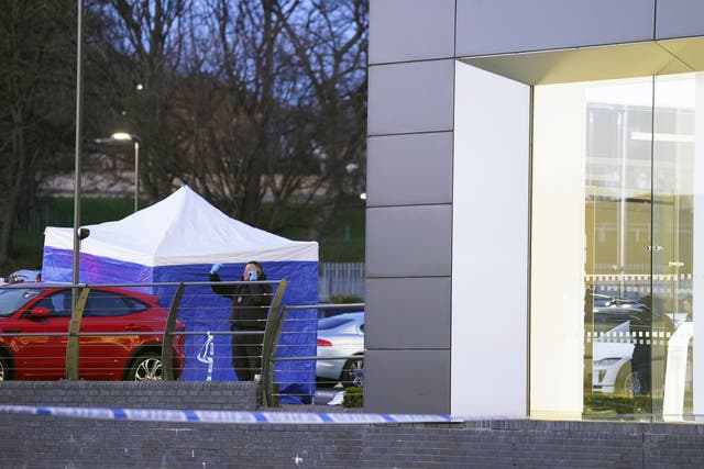 A police tent outside Vertu Jaguar Leeds dealership in Scott Hall Road (Danny Lawson/PA)