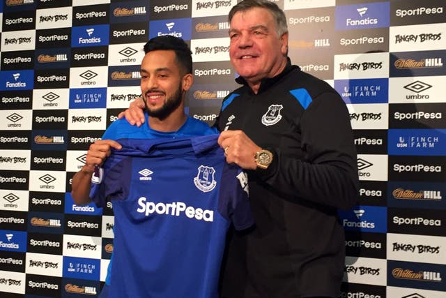 Theo Walcott with manager Sam Allardyce as he is unveiled as an Everton player (Carl Markham/PA)