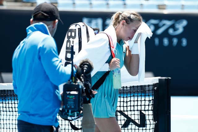 <p>Anett Kontaveit of Estonia walks off 1573 Arena as play is suspended due to extreme heat</p>