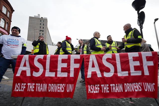 Members of the Aslef Union picket at New Street station in Birmingham (PA)