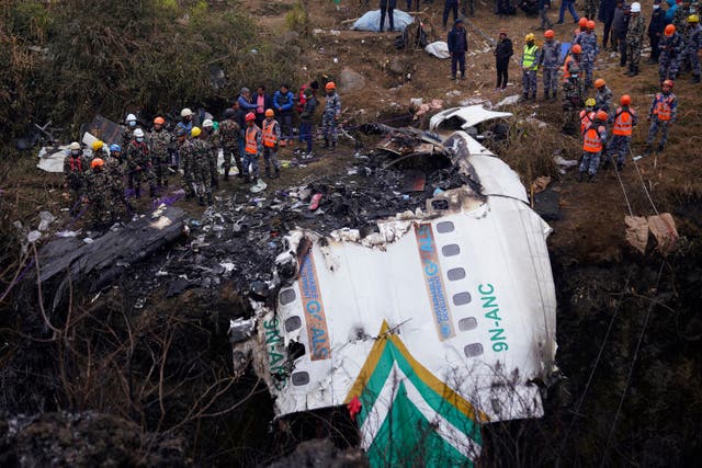 <p>File. Rescuers scour the crash site in the wreckage of a passenger plane in Pokhara, Nepal, Monday, 16 January 2023</p>