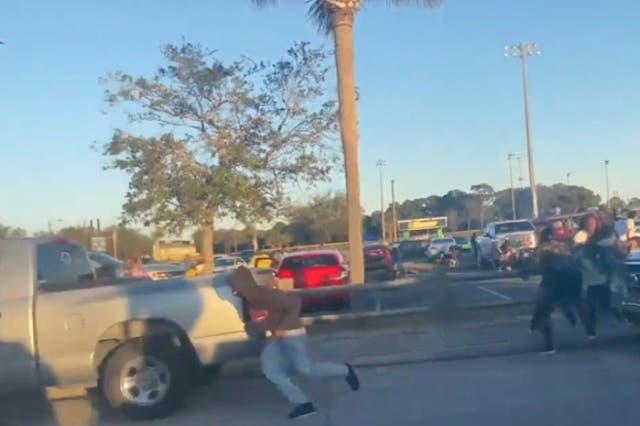 <p>Terrifying footage captures people fleeing from the gunfire</p>