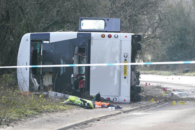 The scene on the A39 Quantock Road in Bridgwater after a double-decker bus overturned in a crash involving a motorcycle (Andrew Matthews/PA)
