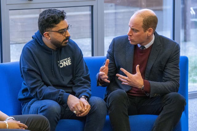 The Prince of Wales (right) speaks with support worker Faizaan Hamid during his visit to Together as One (until recently known as Aik Saath) in Slough, a charity dedicated to working with young people to create positive social change in the community that celebrates its 25th anniversary this February. Picture date: Tuesday January 17, 2023.