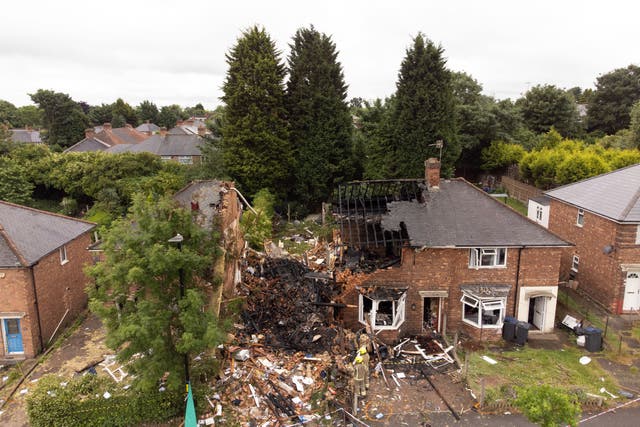 The remains of the house in Dulwich Road, Kingstanding, Birmingham. (Joe Giddens/PA)