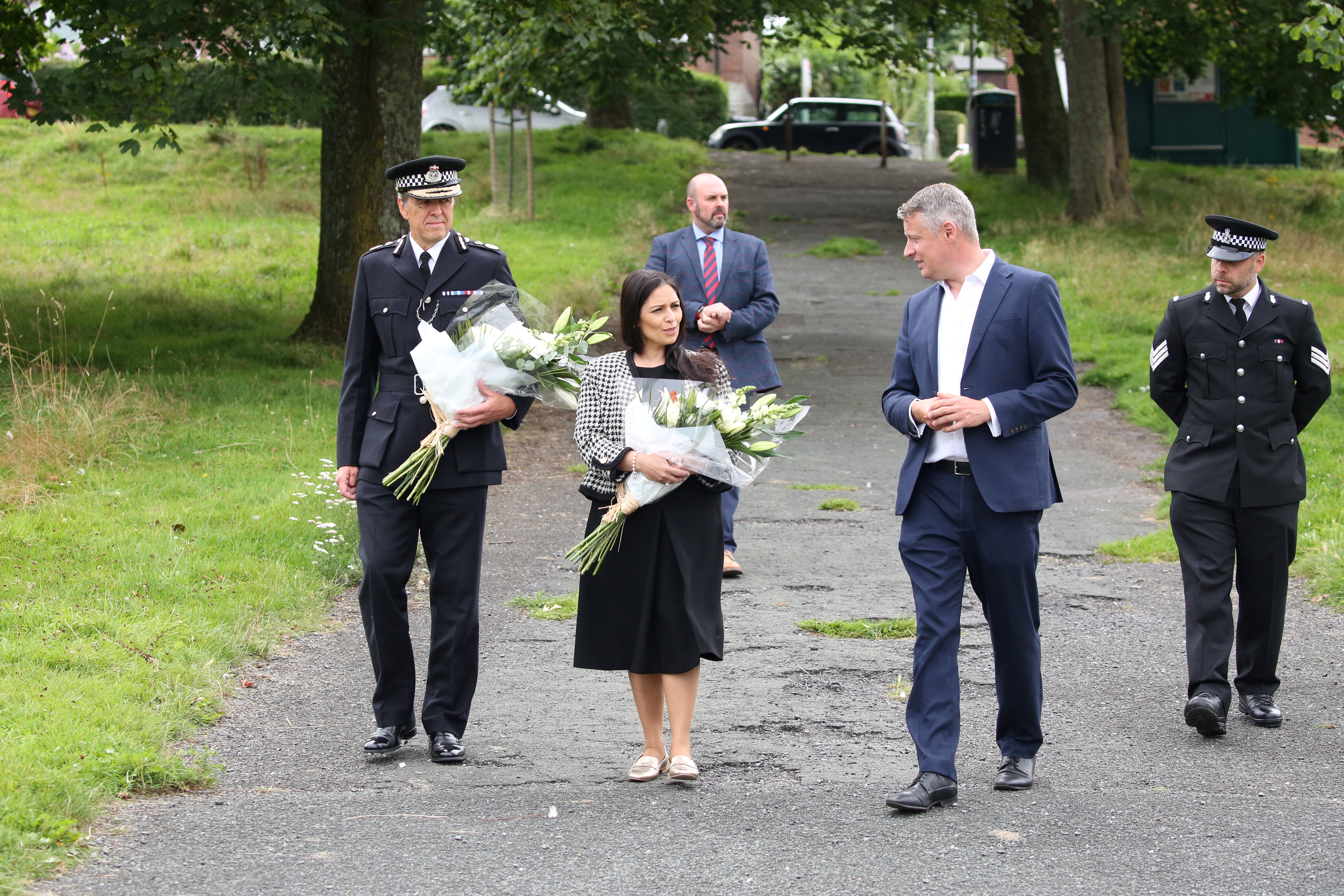 The then home Secretary Priti Patel lays flowers in memory of the five victims of the mass shooter Jake Davison