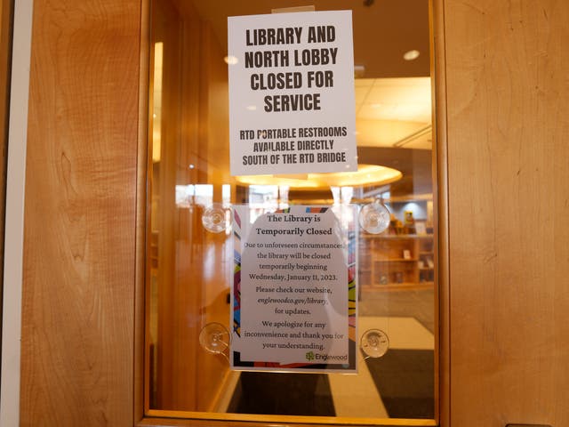 <p>Signs are placed on the outside doors to advise visitors that the library as well as a restroom are closed because of meth contamination Thursday, Jan. 12, 2022, in the south Denver suburb of Englewood, Colo. (AP Photo/David Zalubowski)</p>