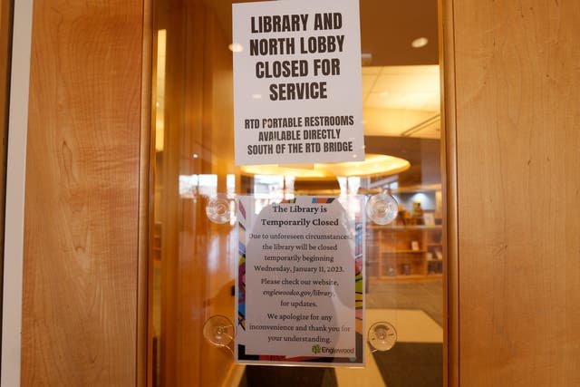 <p>Signs are placed on the outside doors to advise visitors that the library as well as a restroom are closed because of meth contamination Thursday, Jan. 12, 2022, in the south Denver suburb of Englewood, Colo. (AP Photo/David Zalubowski)</p>