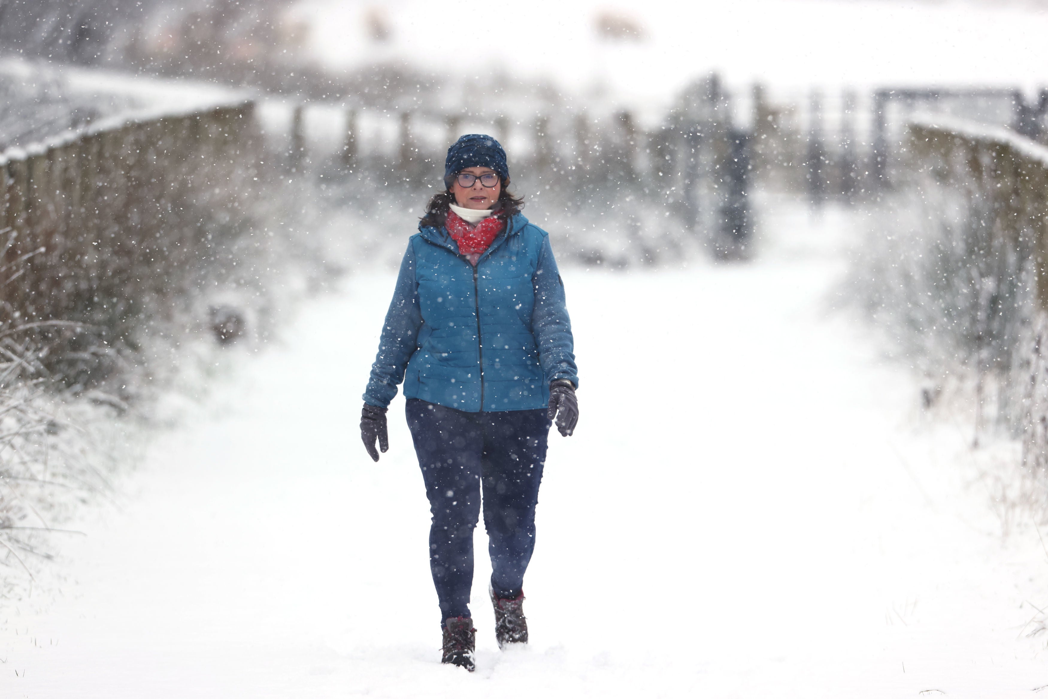 Davina Kerr walking in snowy conditions in Cargan, County Antrim on Tuesday