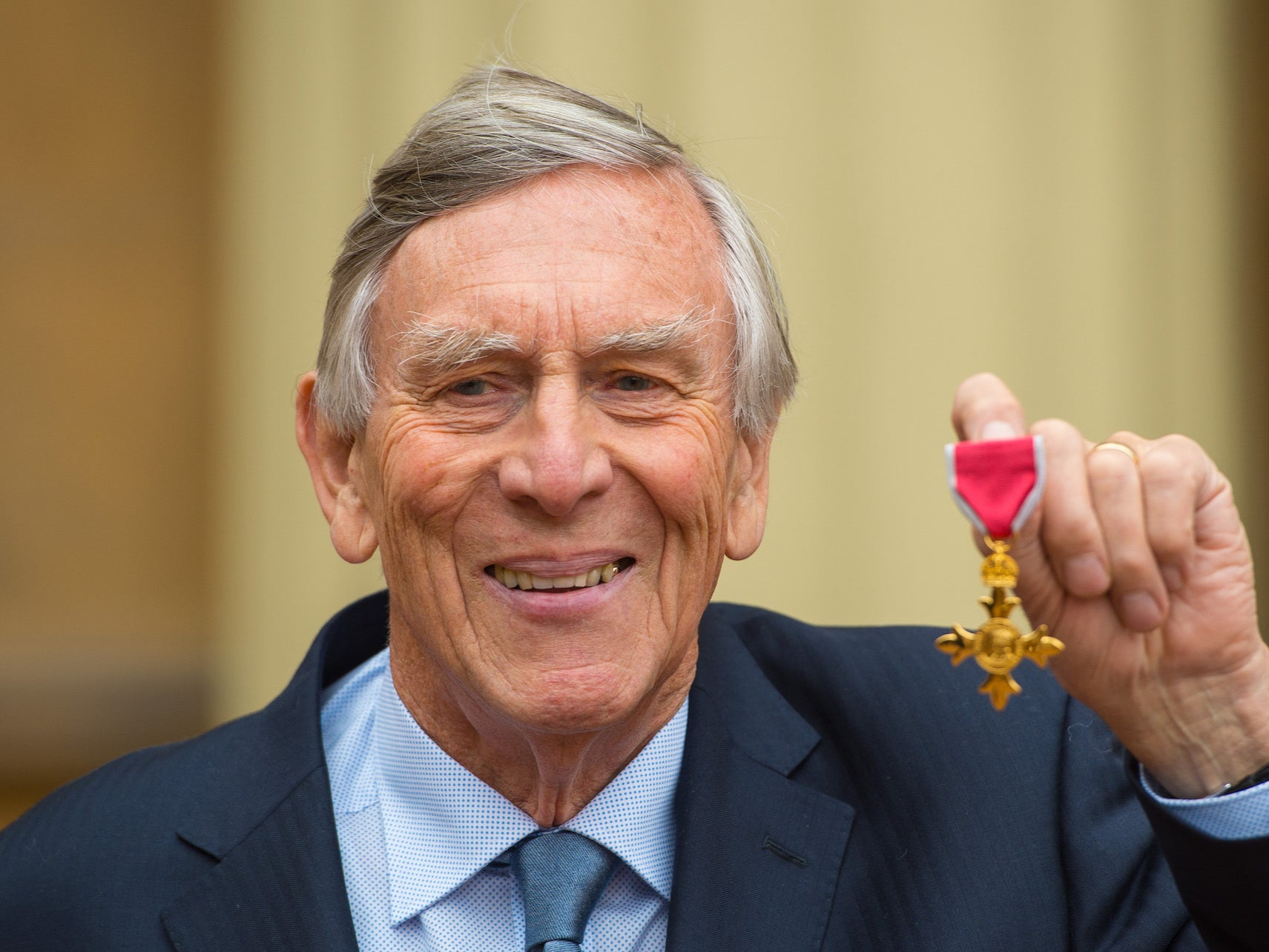 Piers Haggard with his Officer of the Order of the British Empire (OBE) medal