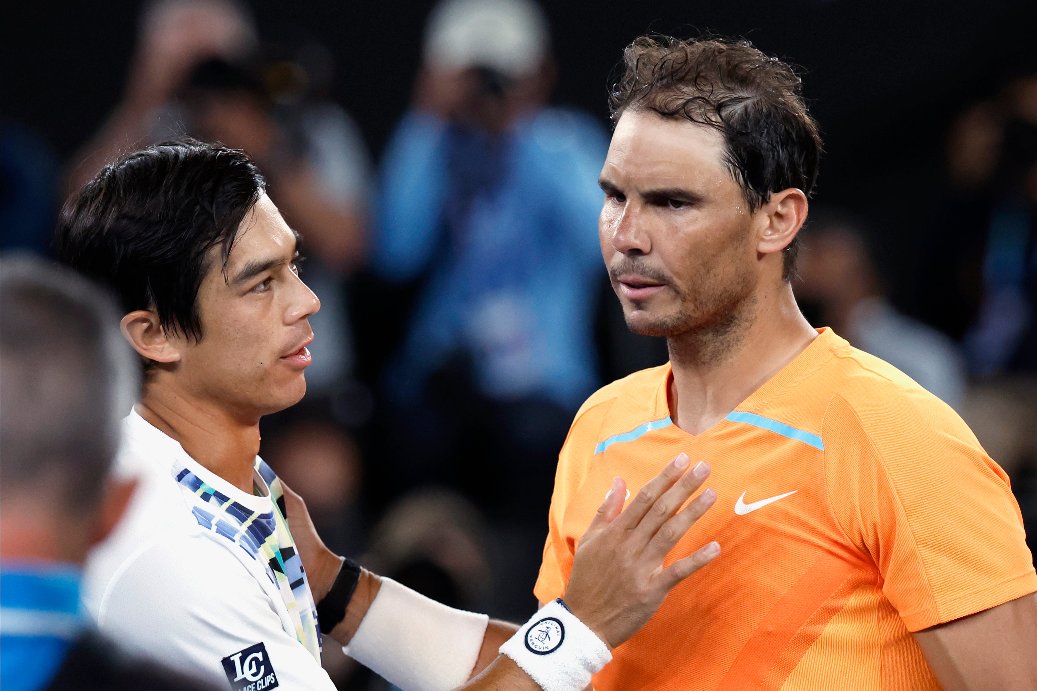Rafael Nadal, right, of Spain congratulates Mackenzie McDonald of the U.S