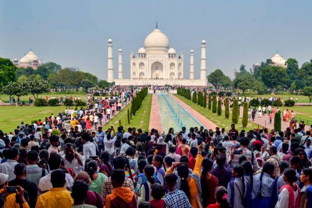 In this photograph taken on October 29, 2022, tourists visit the Taj Mahal in Agra