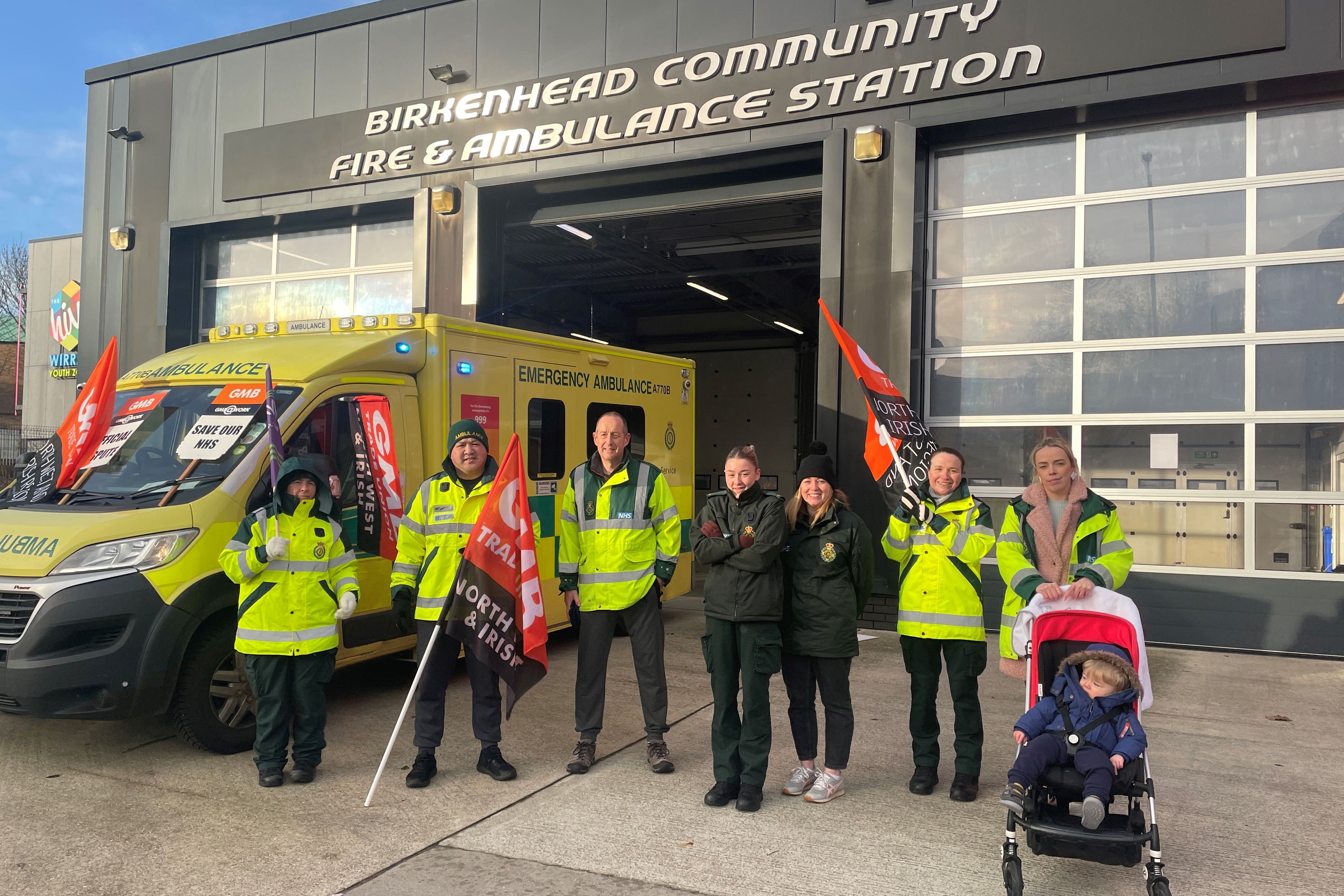 Ambulance workers on the picket line outside Birkenhead Fire and Ambulance Station (Eleanor Barlow/PA)