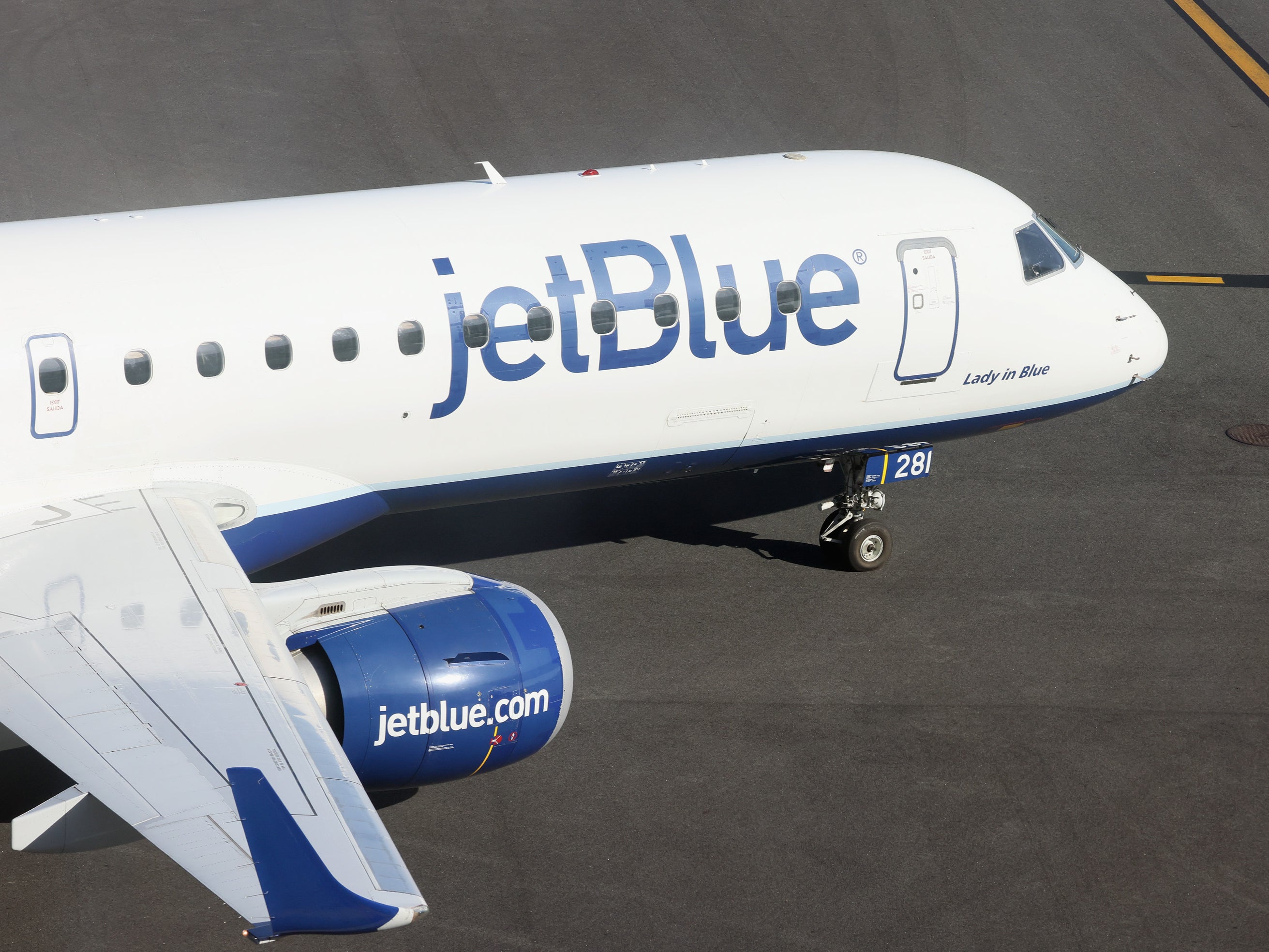 A JetBlue jet moves along the runway at Laguardia AIrport on November 10, 2022 in the Queens borough of New York City