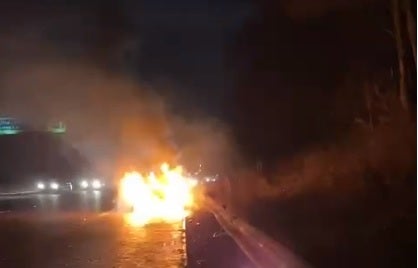 The couple’s car on fire on the M61
