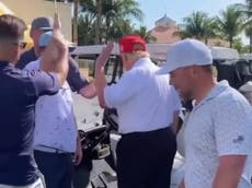 Awkward video shows Trump ducking a high five from admirer