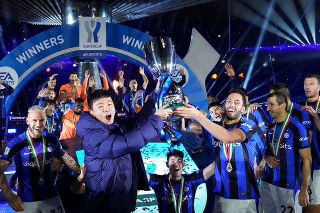 Inter Milan celebrate their Italian Super Cup success over AC Milan (AP/Hussein Malla/PA)