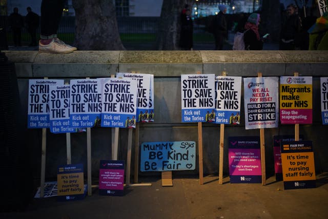 Placards placed against a wall in Whitehall, London, during the nurses strike, against the Bill on minimum service levels during strikes. Picture date: Wednesday January 18, 2023 (Yui Mok/PA)