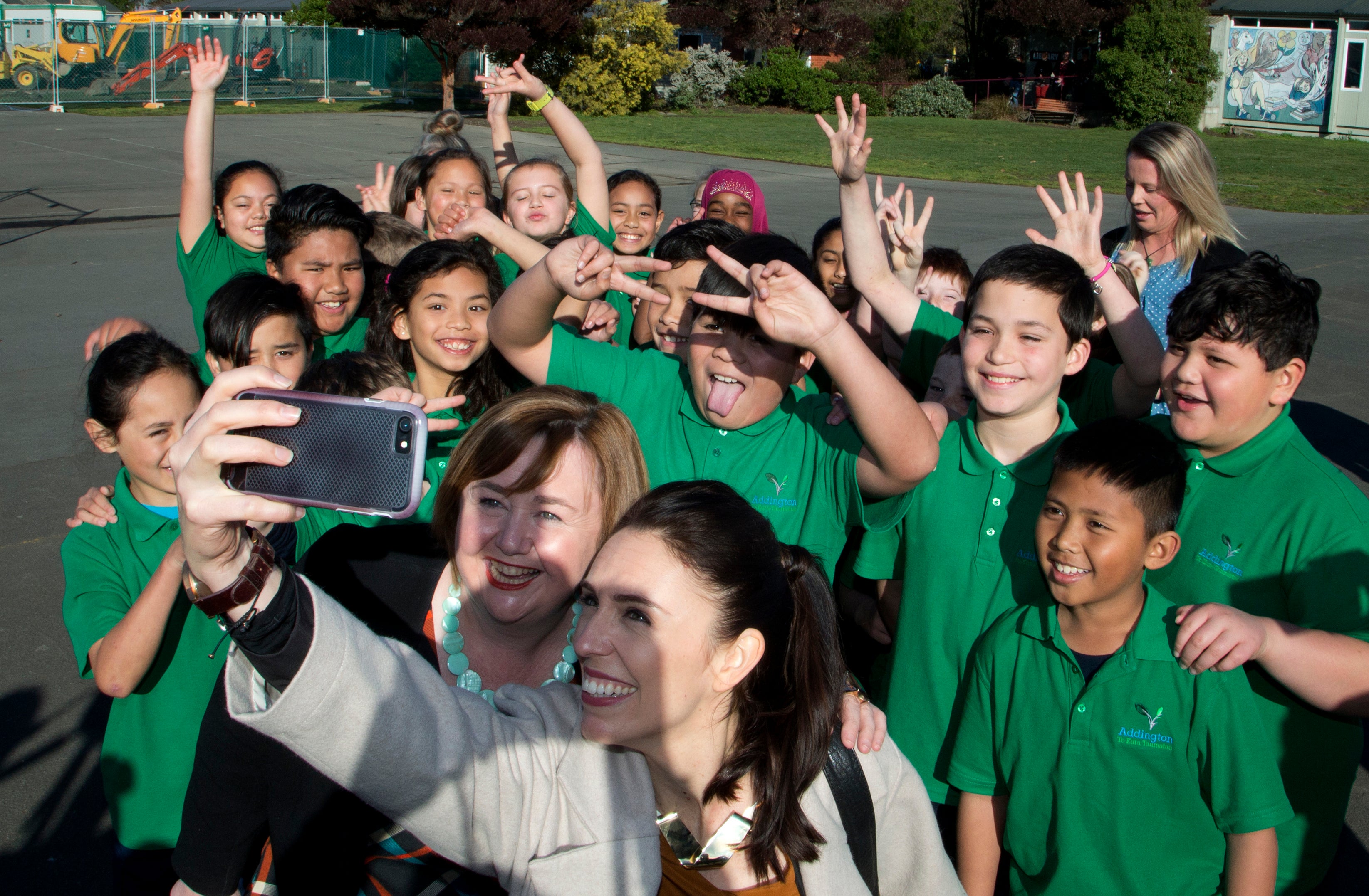 Ms Ardern grabs a selfie with students of Addington School in Christchurch, in 2017