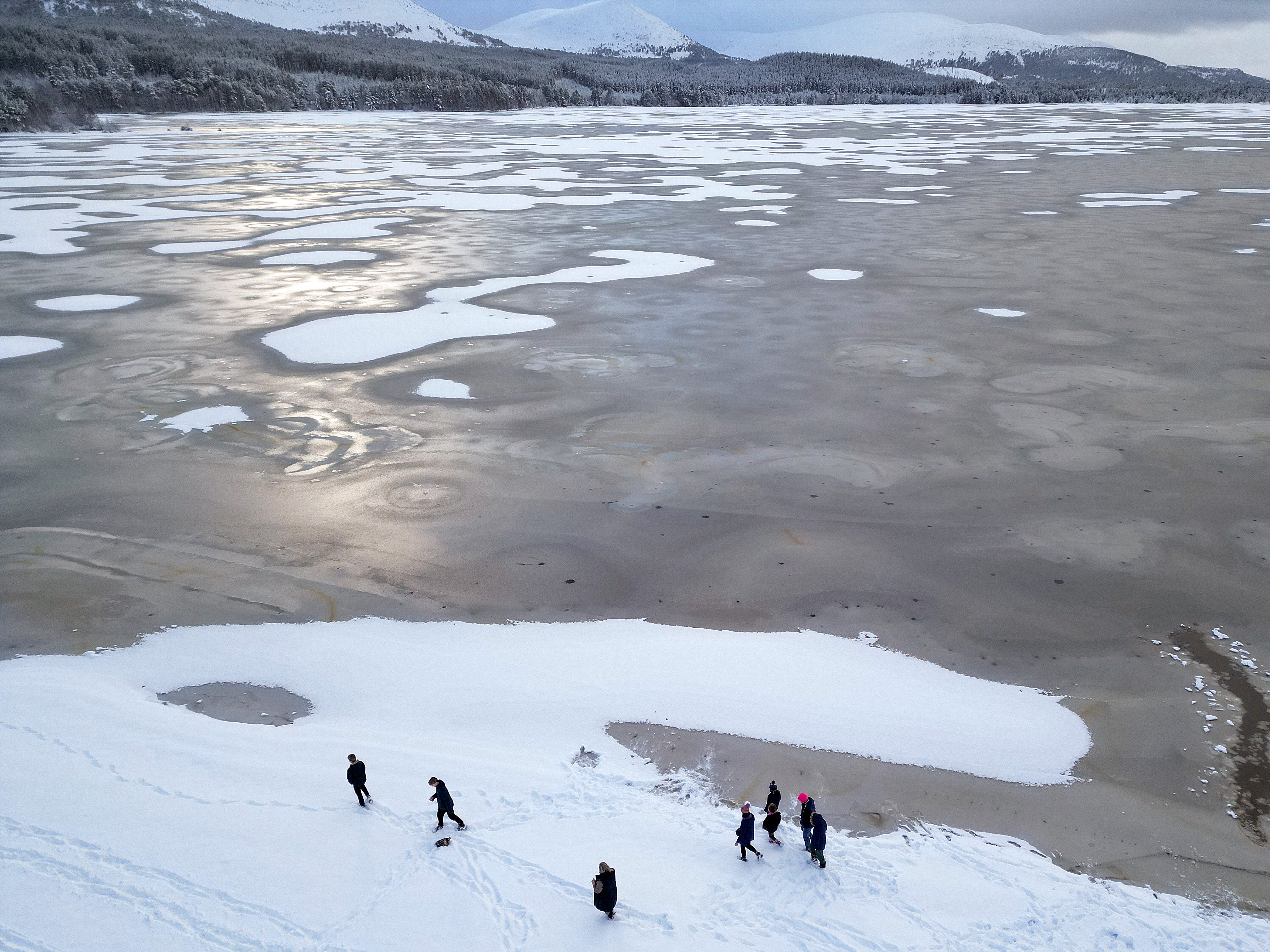 Loch Morlich in the Scottish Highlands was frozen over on Wednesday, ahead of the coldest night of 2023 so far