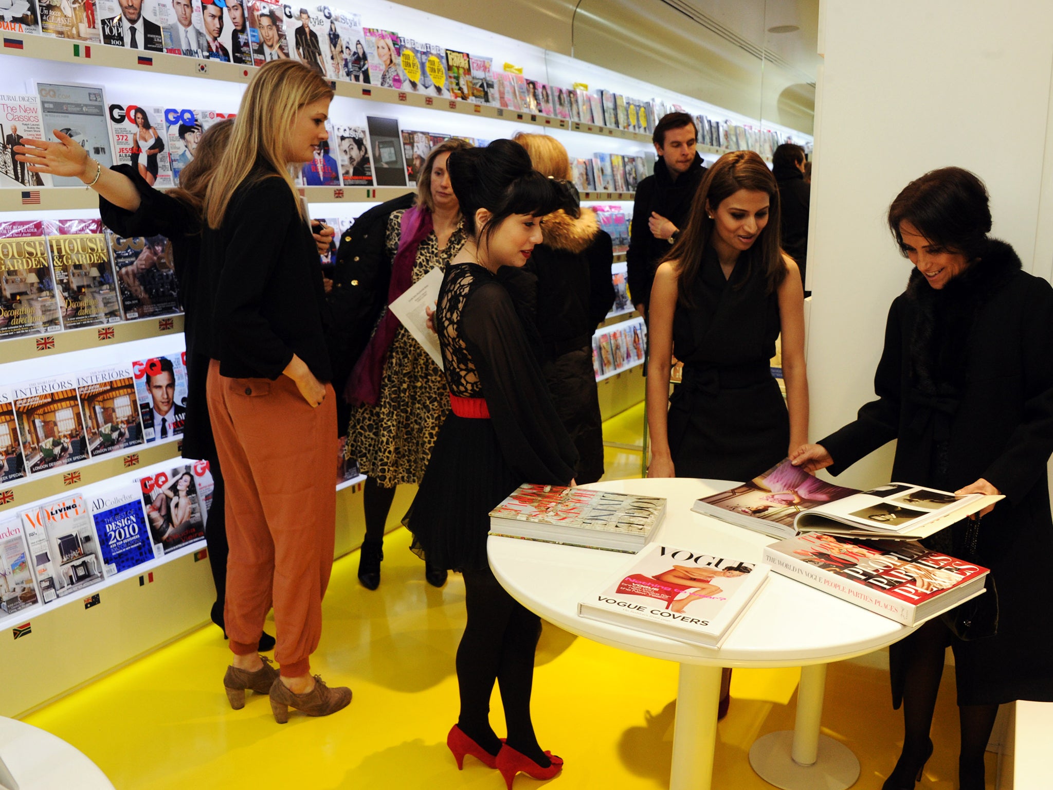 Vogue House employees mingle among the magazines in 2011