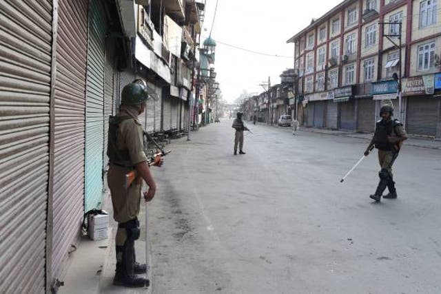 <p>File Indian paramilitary troopers patrol during a curfew in Srinagar on July 8, 2017</p>