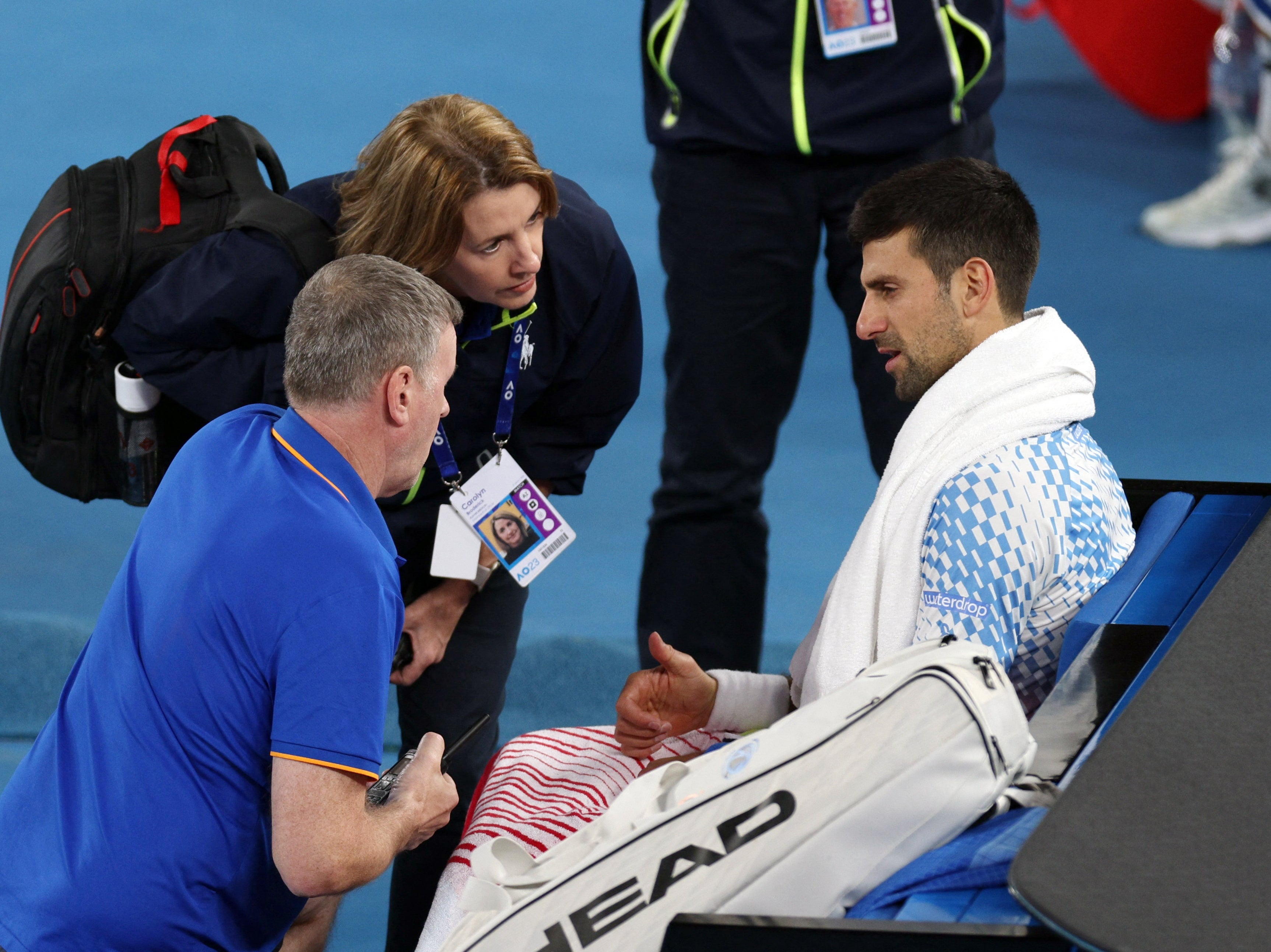 Novak Djokovic is given treatment for his hamstring injury