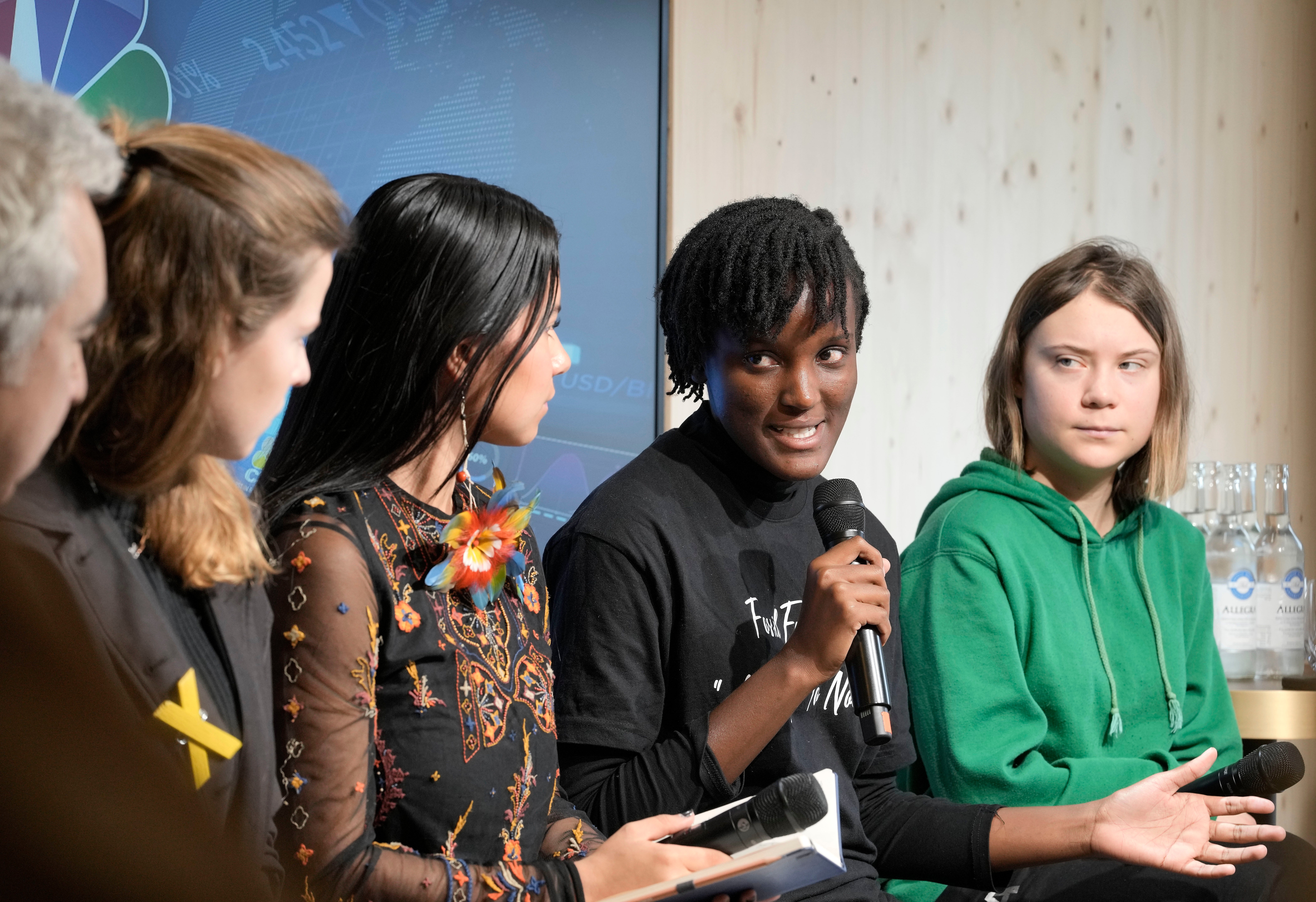 From right: Climate activists Greta Thunberg of Sweden, Vanessa Nakate of Uganda, Helena Gualinga of Ecuador, Luisa Neubauer of Germany, and Fatih Birol, Head of the International Energy Agency, at the World Economic Forum in Davos, Switzerland in January