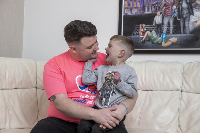 Daithi MacGabhann, with his father Mairtin MacGabhann at their home in Belfast, is waiting for an organ transplant (Liam McBurney/PA)