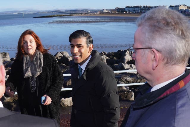 Prime Minister Rishi Sunak, centre, and Minister for Levelling Up, Housing and Communities Michael Gove on Morecambe seafront (Owen Humphreys/PA)