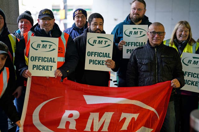 <p>RMT members on strike </p>