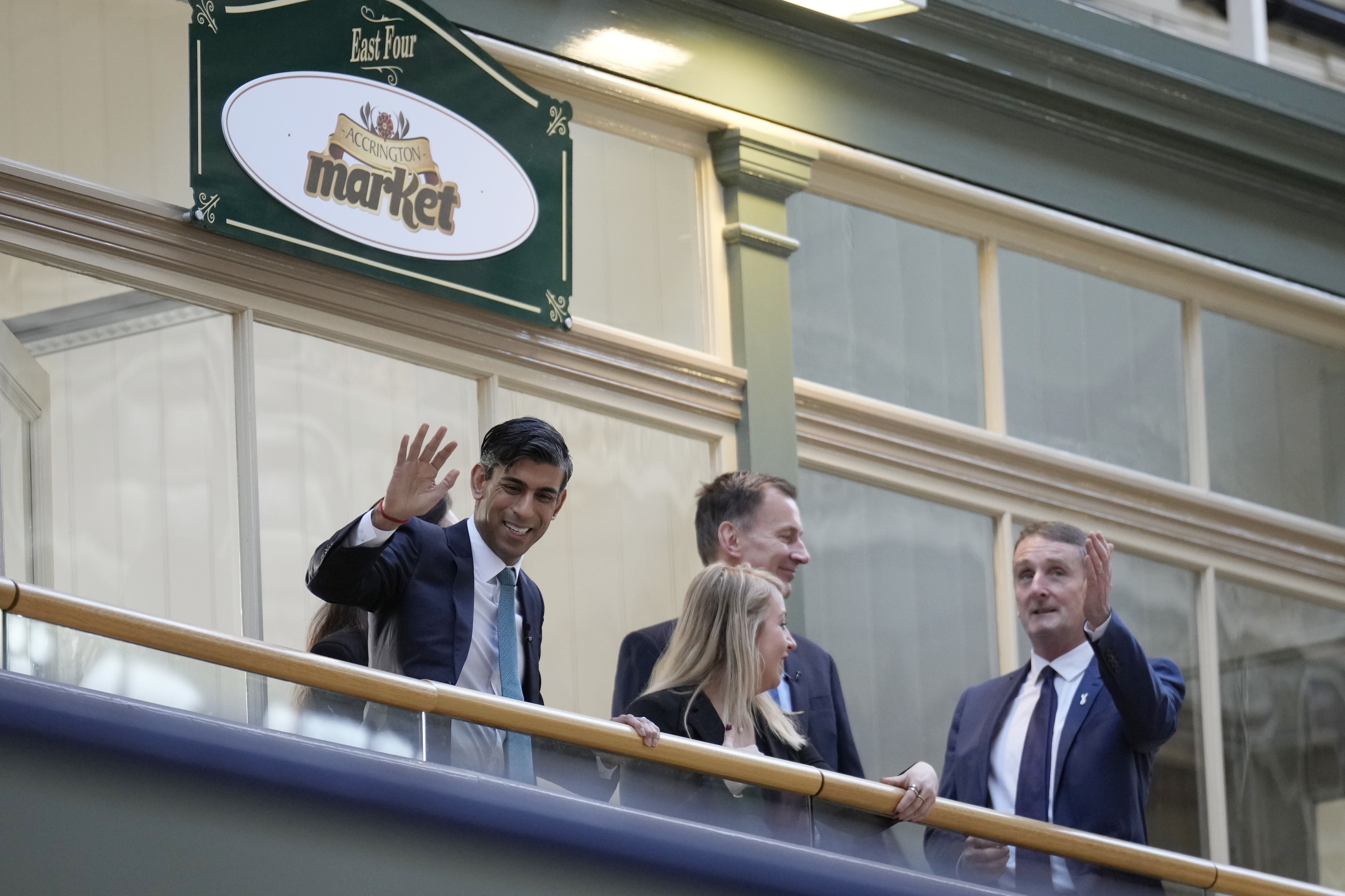 Prime Minister Rishi Sunak, left, during a visit to Accrington Market Hall in Lancashire (Christopher Furlong/PA)