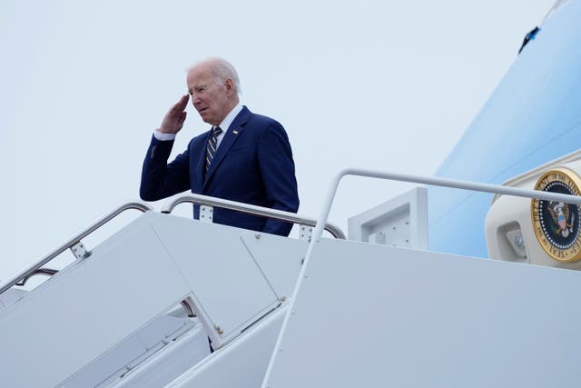 <p>President Joe Biden salutes at the top of the steps of Air Force One at Andrews Air Force Base</p>