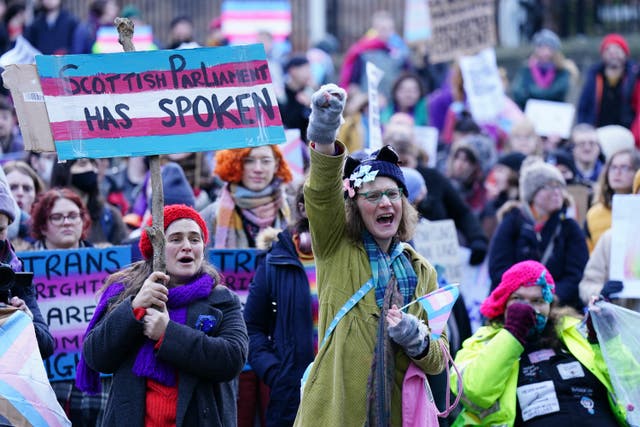 People take part in a demonstration for trans rights outside the Scotland Office in Edinburgh (Jane Barlow/PA)