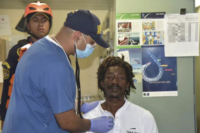 <p>Elvis Francois, 47, is checked by Columbian naval medical personnel after spending 24 days lost at sea</p>