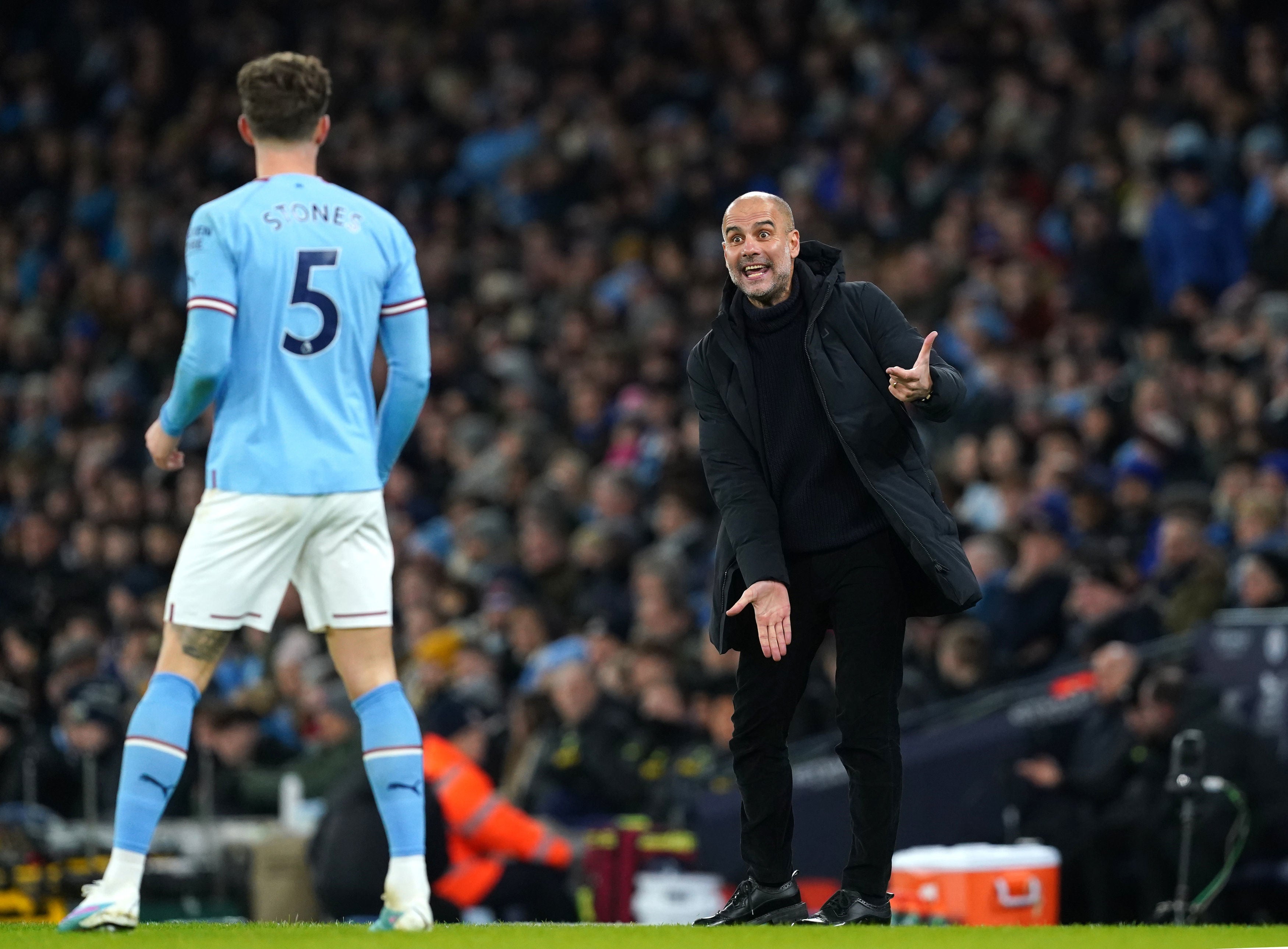 Pep Guardiola gesticulates from the touchline during City’s win over Spurs