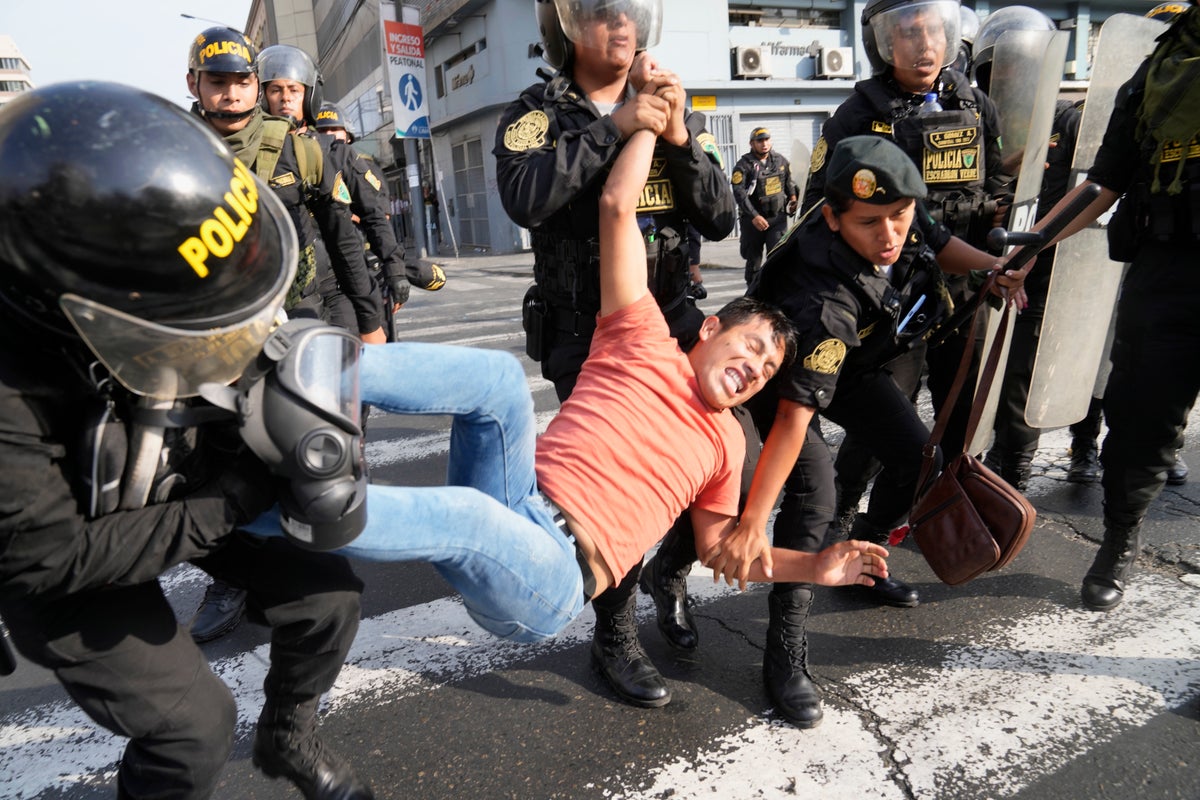 Protests move into Peru’s capital amid smoke and tear gas