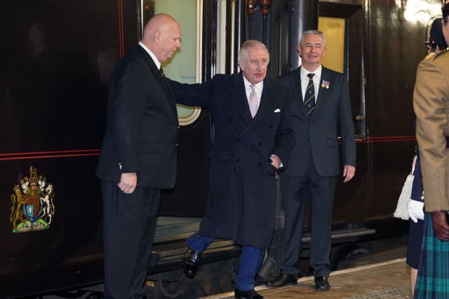 King Charles III arriving via the royal train at Manchester Victoria Station for a visit with the Queen Consort to Greater Manchester (Owen Humphreys/PA)